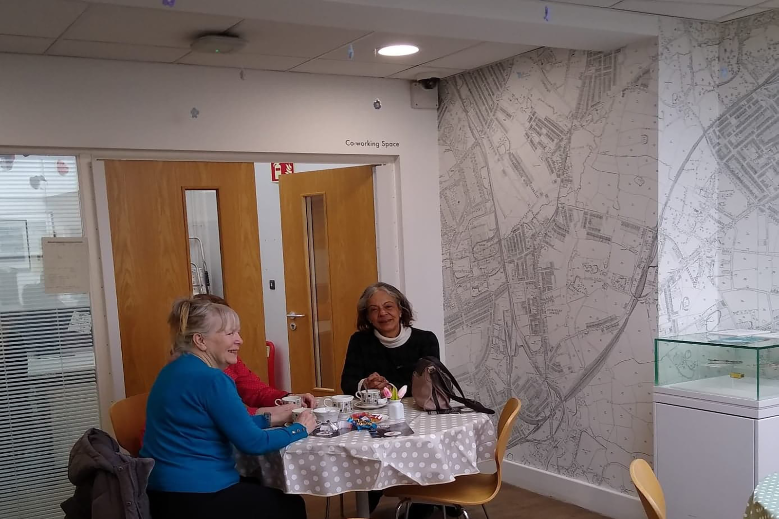 Visitors enjoying a coffee and a chat.